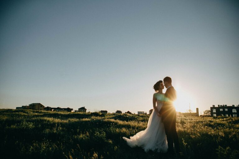 bride and groom on green grass field